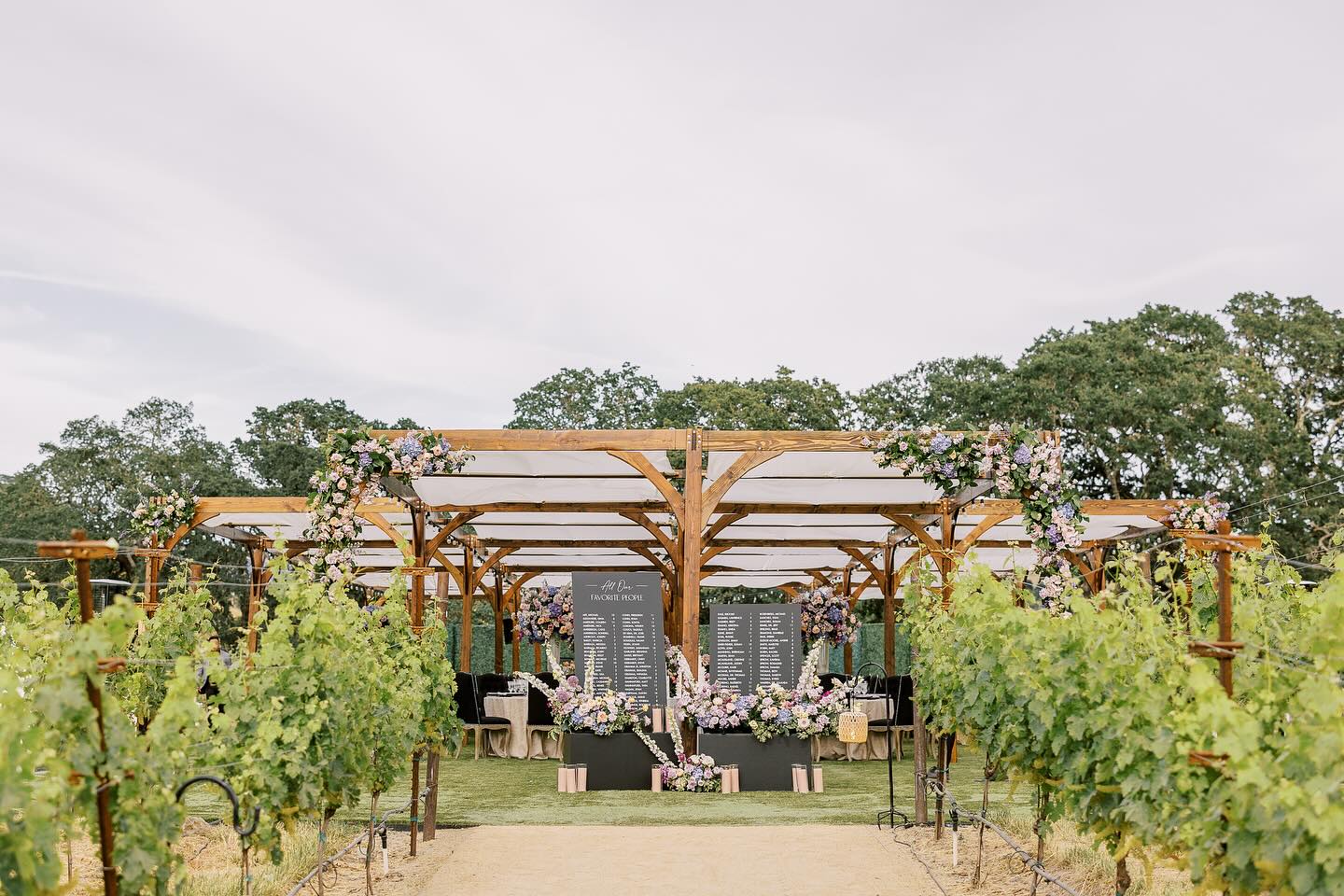 Our wood structure nestled in the vineyard at @montagehealdsburg captured by @sarahfolsomphoto. Always a dream working with @coledrakeevents!
Vendors:
Photo: @sarahfolsomphoto
Planning & Design: @coledrakeevents
Venue: @montagehealdsburg
Florals: @jennifercoleflorals
Video: @hitmakerfilms
Ceremony music: @winecountryentertainment @synchronicitystrings
Band: @georgiabridgwater @jordankahnorchestra
DJ: @thisismayo
Stationery & live painter: @chezlamariee
Beauty: @tredayy_
Bridal gown: @eseazenabor
Attire: @theweddingdetailor
Transportation: @calwinetours
Pergola: @zephyrtents
Rentals: @theonicollection @brighteventrentals
Seating chart: @boovaradesigns
Cake: @flourandbloomcakes
Art styling surface: @elysianmarket