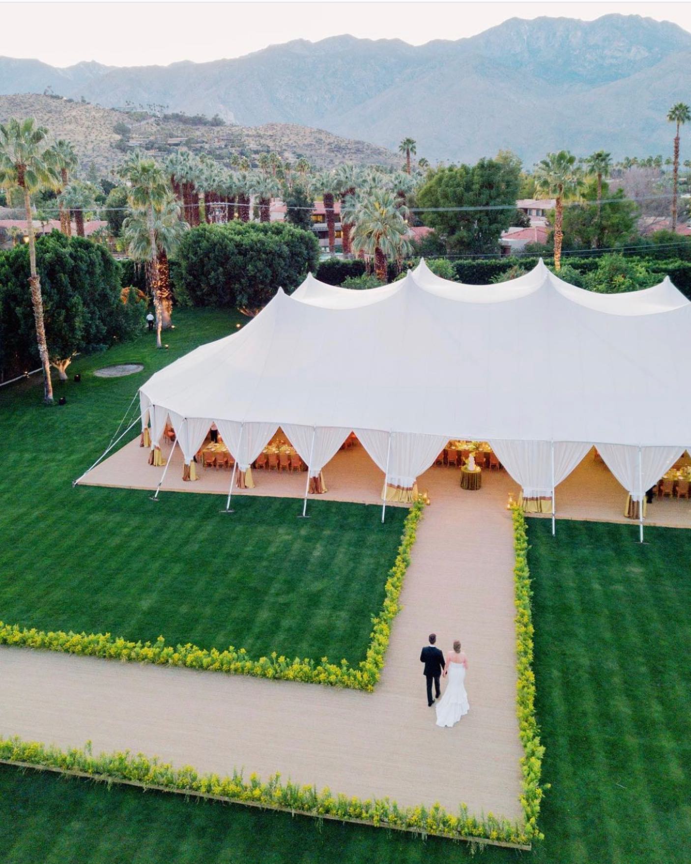 We couldn’t resist sharing this incredible photo from @corbingurkin of the epic guest entrance designed by @lauriearons @kaeskitskolase and @sarah_winward for this weekend’s Palm Springs wedding. A pleasure working with @shauger1 @bellavistadesigns @parkerpalmsprings @casadeperrin @westcoastmusicbevhills @tacer_losangeles @theweddingdetailor @urbanparlour @theonicollection @elysiumweddings @thewatercottage #zephyrtents #palmspringswedding
