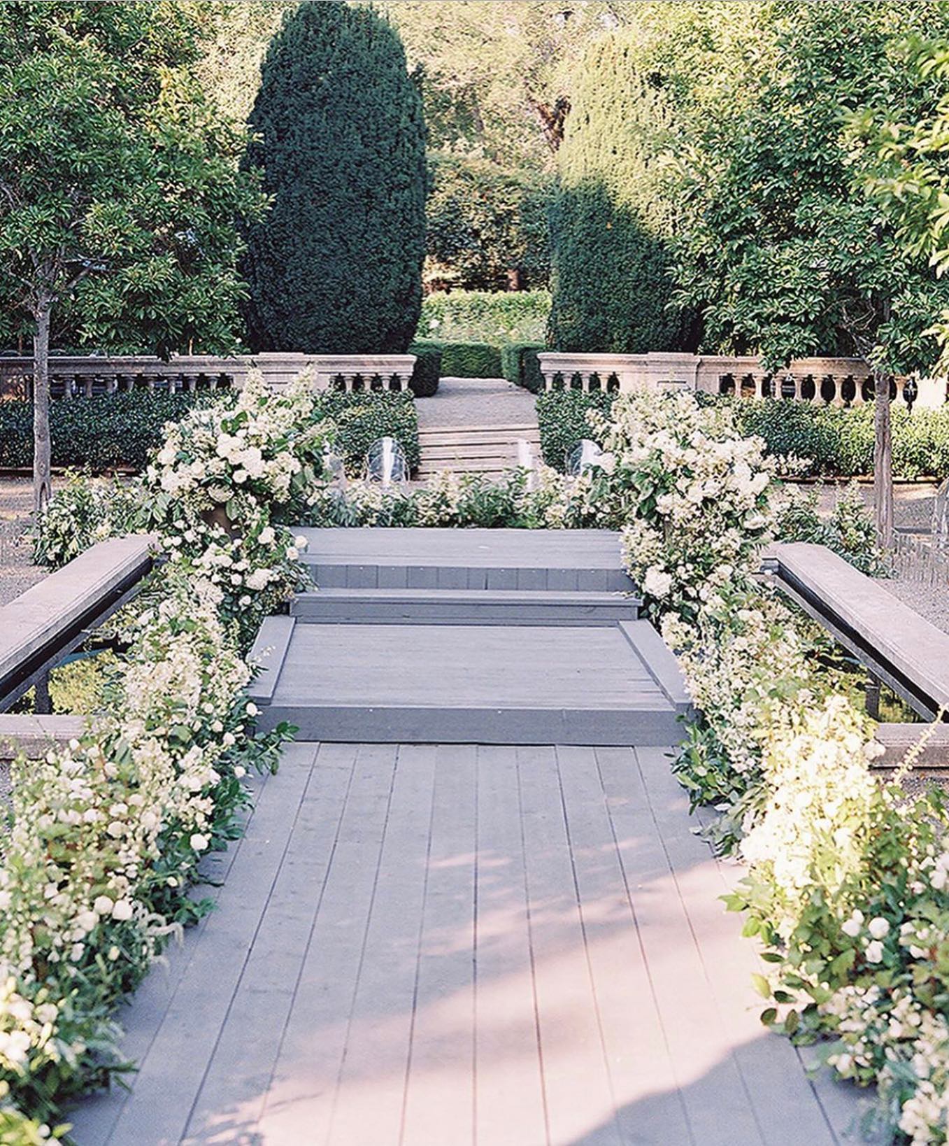 We’re always up for jumping in a fountain to build a ceremony walkway! Thank you to @jacinfitzgerald for the challenge. @mindyricedesign always works wonders and what better setting for a ceremony than #beaulieugarden @paulaleduc. Beautifully captured by @tecpetaja and on @caratsandcake today! #zephyrtents